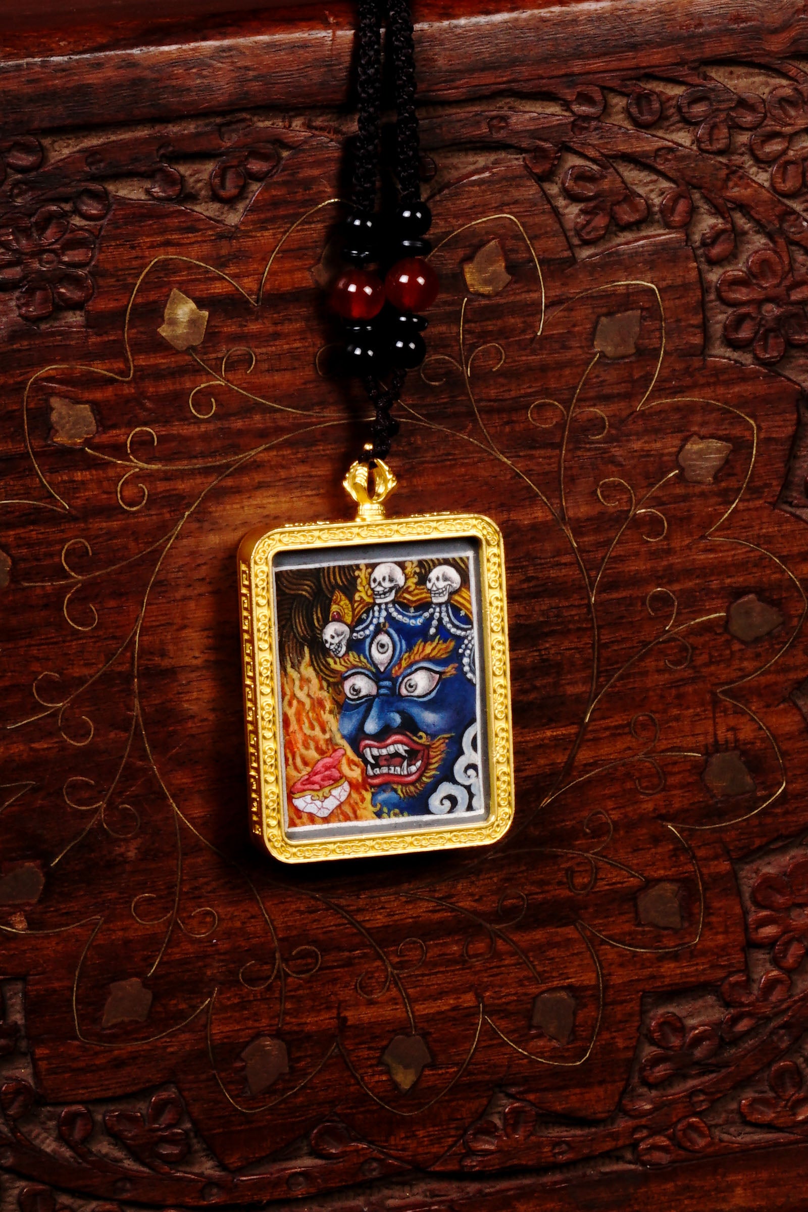 Mahakala Ghau Thangka locket with hand-painted wrathful protector deity artwork inside traditional Himalayan amulet Nepal