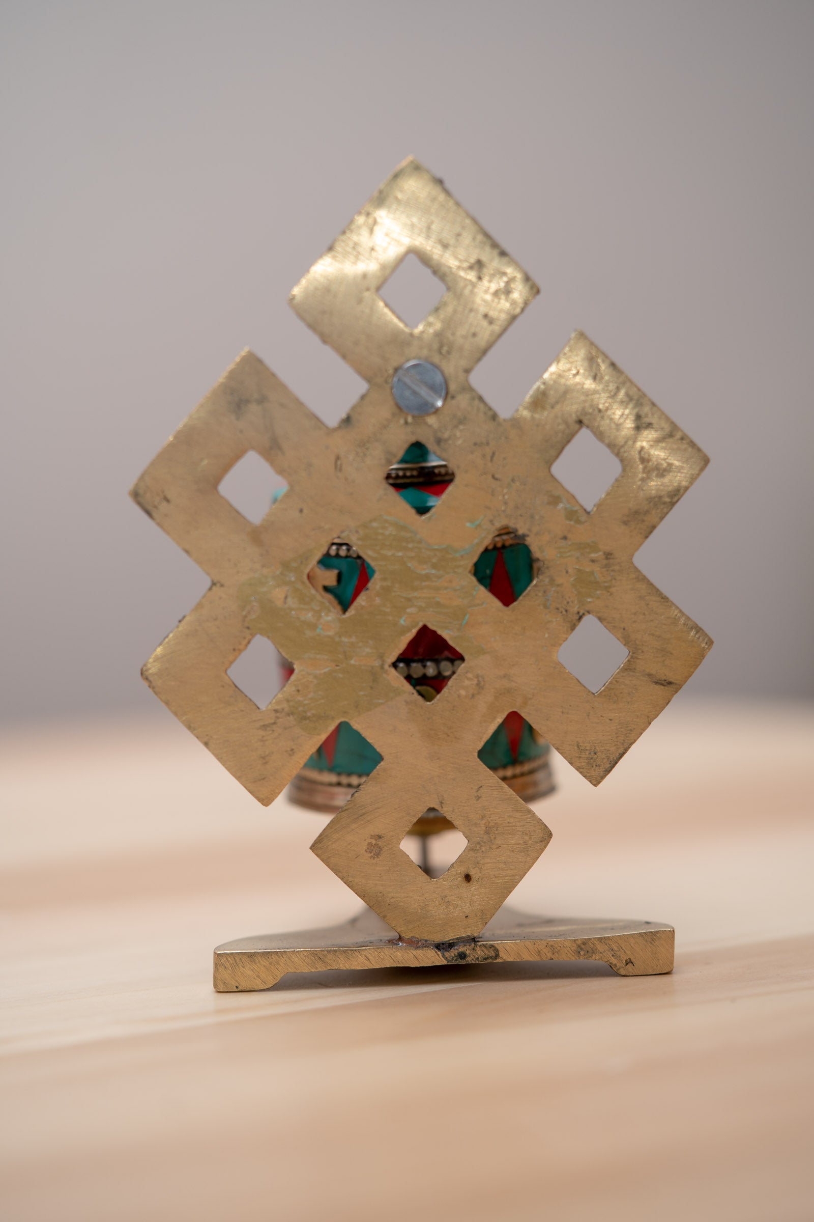 Endless Knot Prayer Wheel serves as a means to cultivate mindfulness and focus.