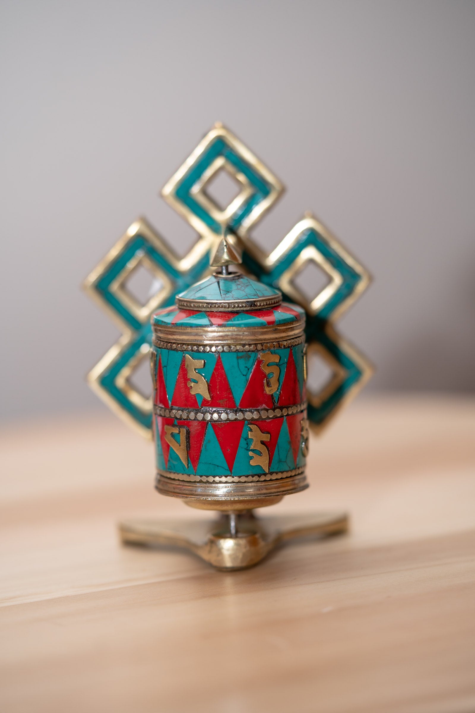 Endless Knot Prayer Wheel serves as a means to cultivate mindfulness and focus.
