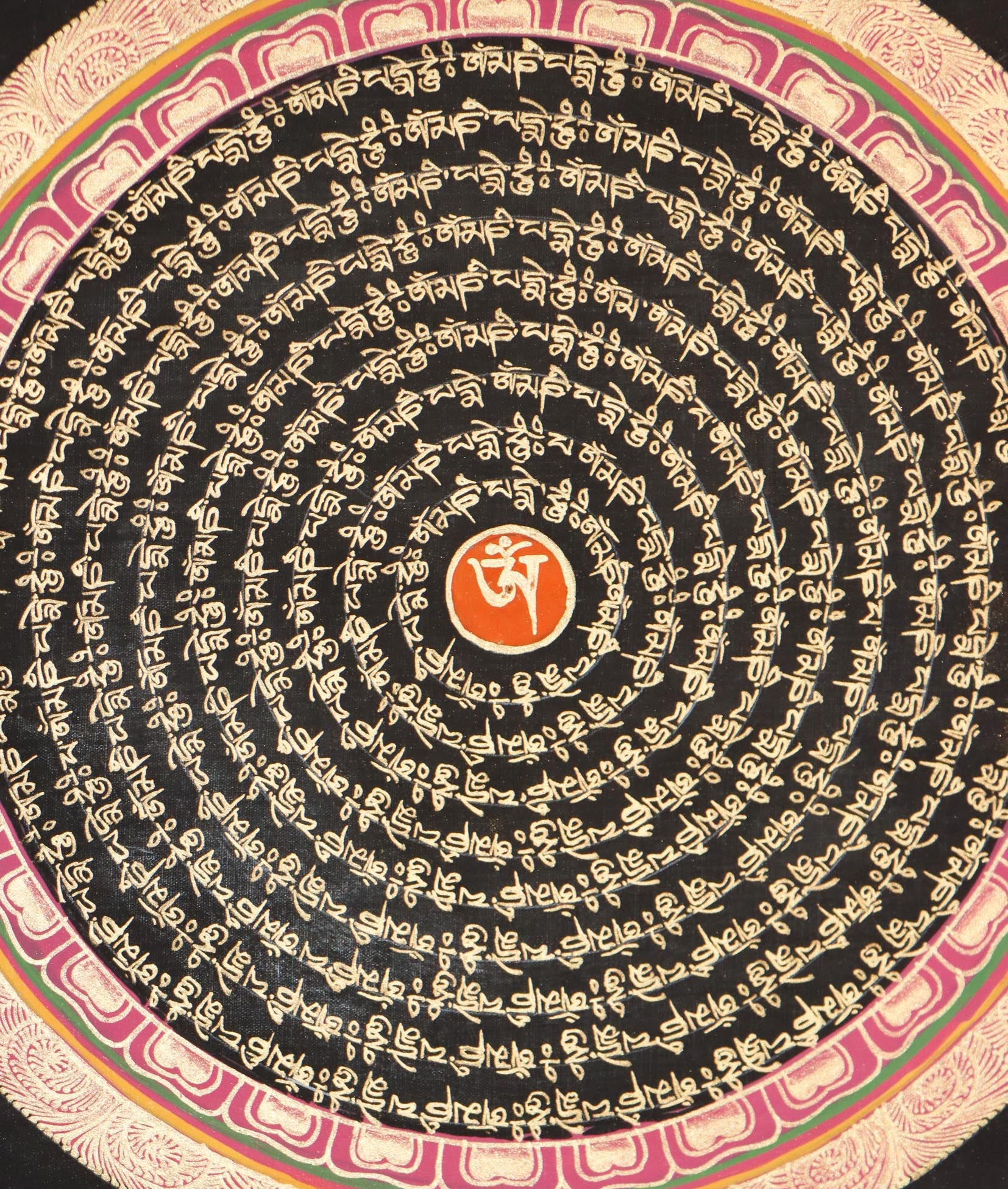 close up view of Mantra Mandala Thangka with om symbol scripted in its center .