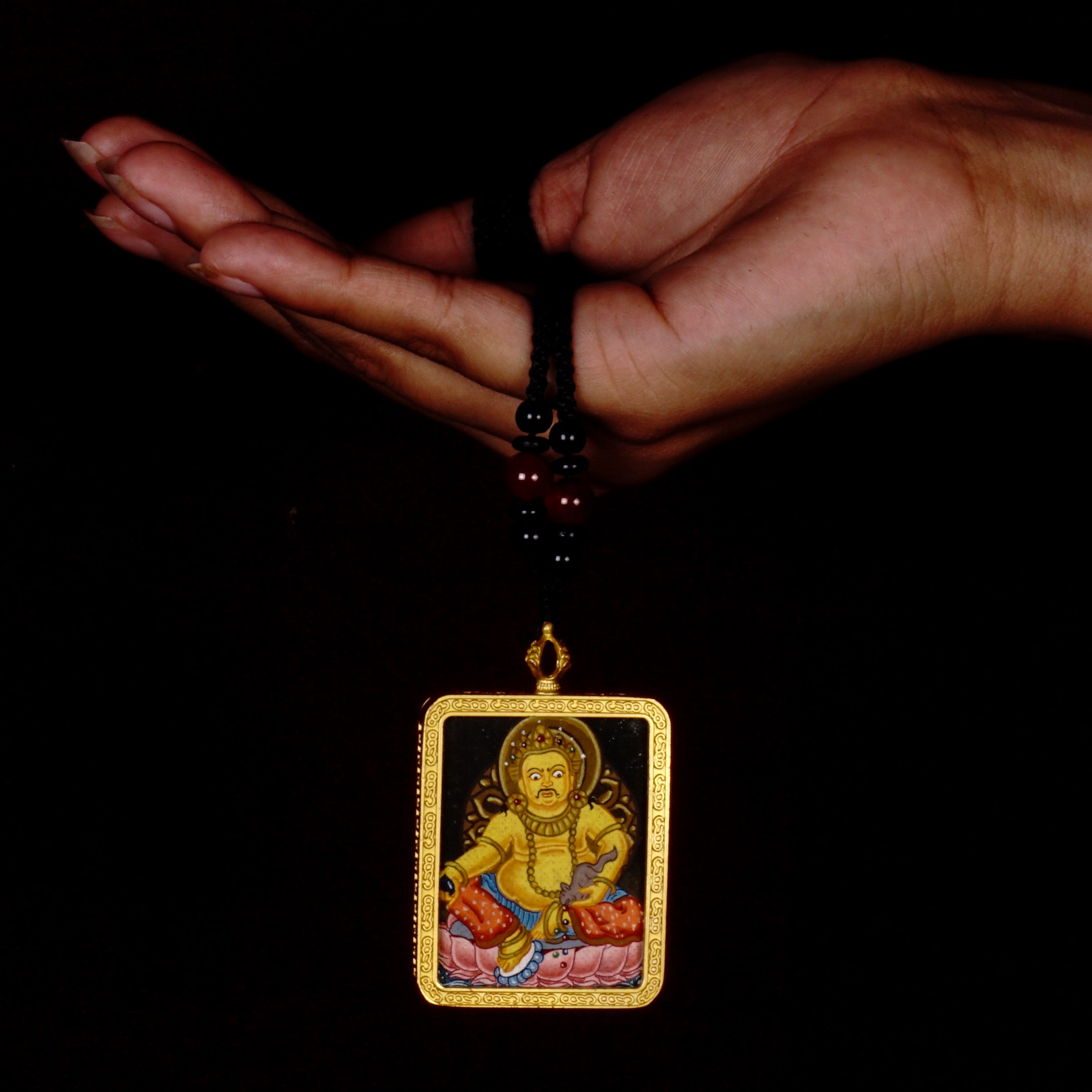 Yellow Zambala ghau locket thangka flow of positive energy.