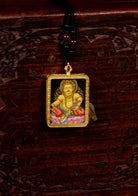 Yellow Zambala ghau locket thangka flow of positive energy.