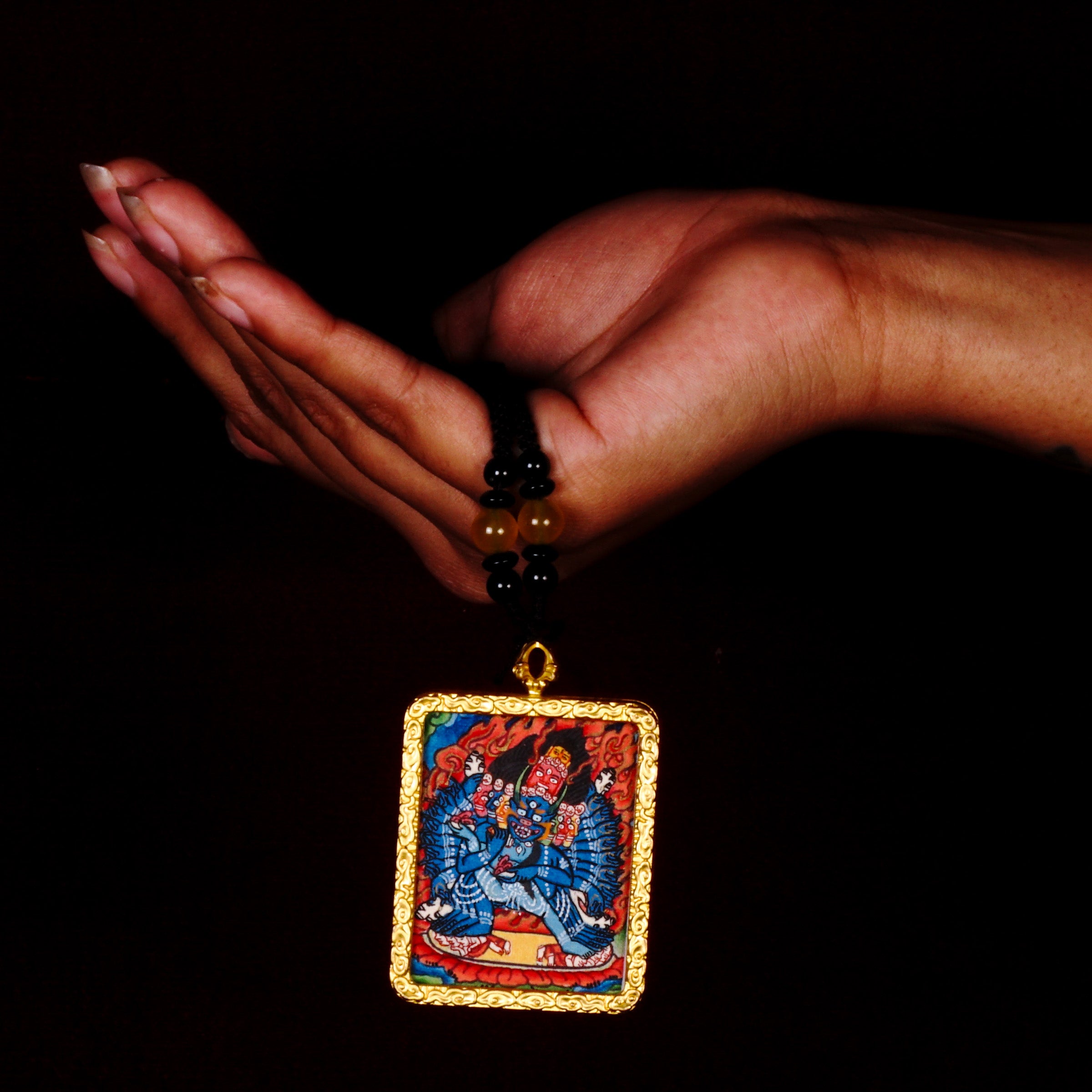Yamantaka Ghau Thangka locket with hand-painted wrathful deity artwork inside traditional Himalayan amulet Nepal