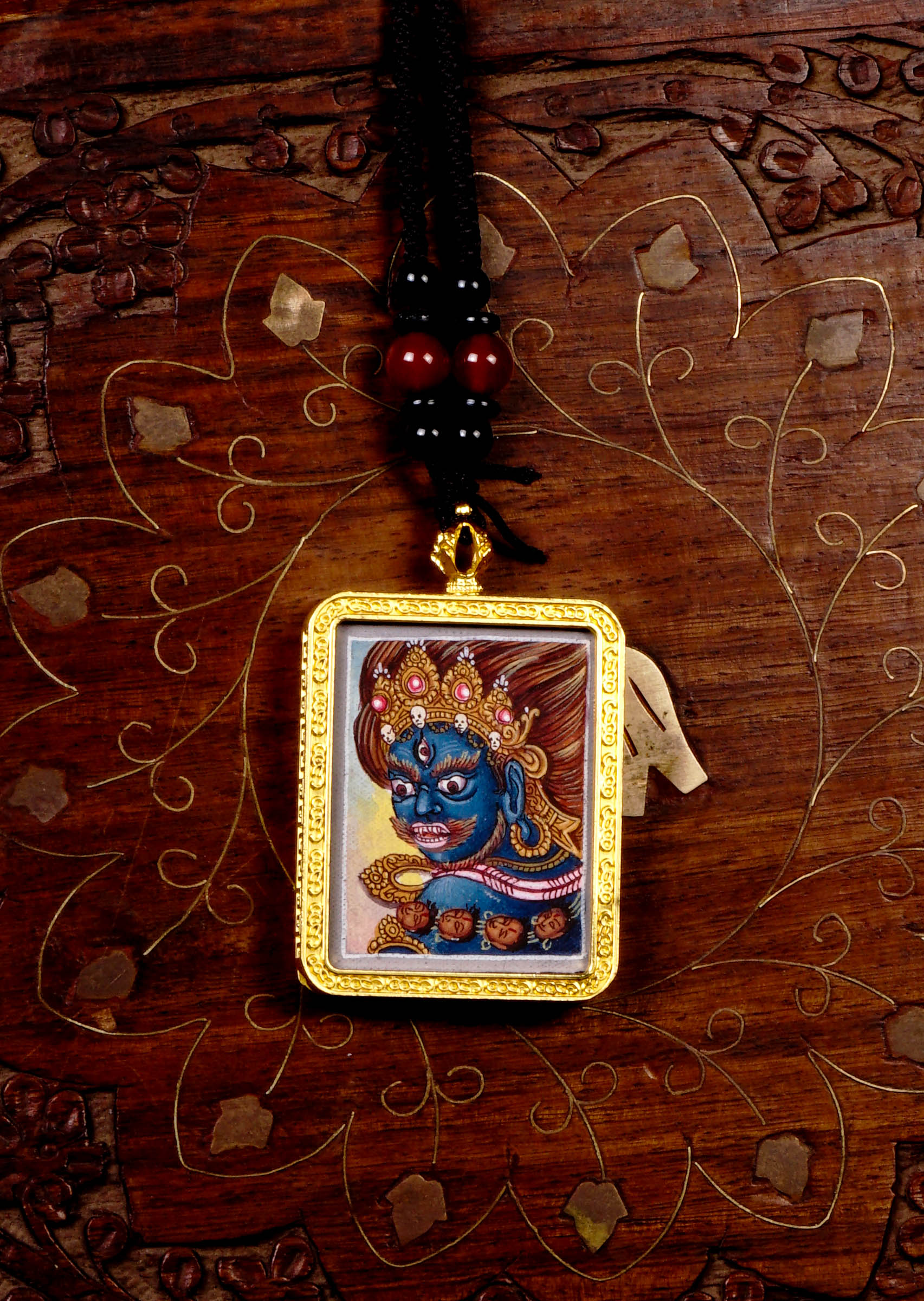 Mahakala Ghau Thangka locket with hand-painted wrathful deity artwork inside traditional Himalayan amulet Nepal
