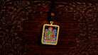 Green Tara Ghau Thangka locket with hand-painted goddess artwork inside traditional Himalayan amulet Nepal