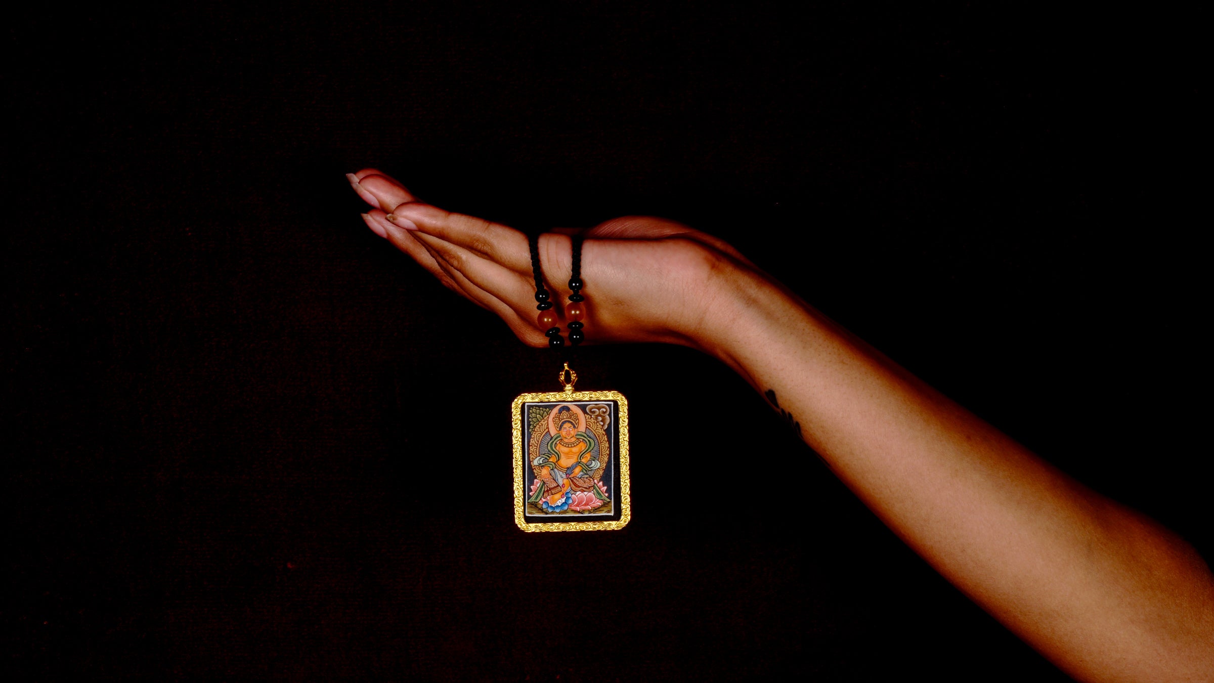 Orange Lotus Zambala Thangka Locket Provides reassurance and emotional stability