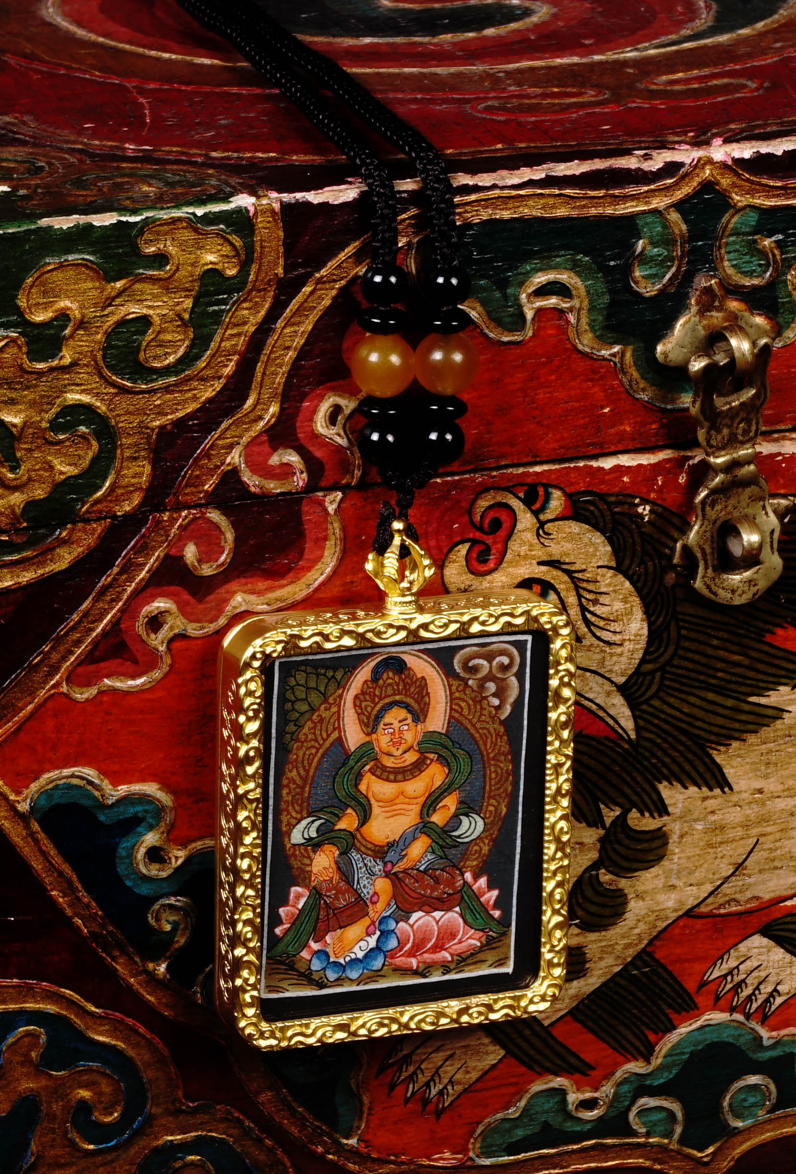 Orange Lotus Zambala Ghau Thangka Locket Provides reassurance and emotional stability