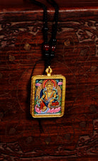 Yellow lotus Zambala ghau Amulet thangka prosperity, purity, and balance