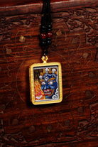 Mahakala Ghau Thangka locket with hand-painted wrathful protector deity artwork inside traditional Himalayan amulet Nepal