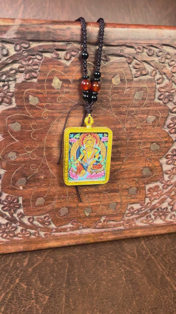 Yellow lotus Zambala ghau locket thangka prosperity, purity, and balance