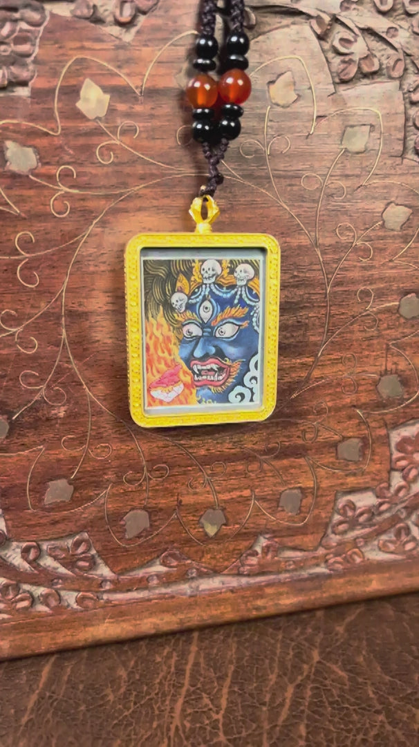 Mahakala Ghau Thangka locket with hand-painted wrathful protector deity artwork inside traditional Himalayan amulet Nepal