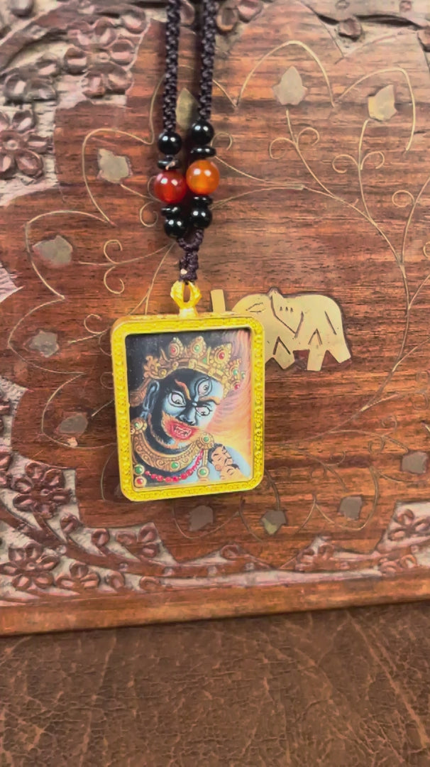 Mahakala Ghau Thangka locket with hand-painted fierce protector deity artwork inside traditional Himalayan amulet Nepal