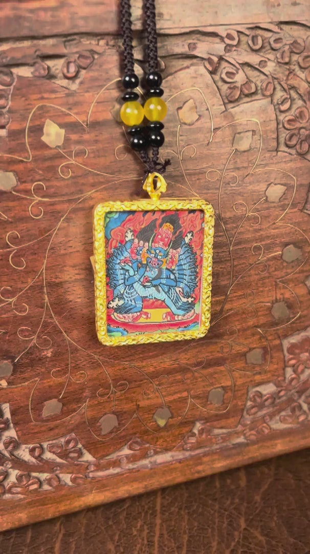 Yamantaka Ghau Thangka locket with hand-painted wrathful deity artwork inside traditional Himalayan amulet Nepal