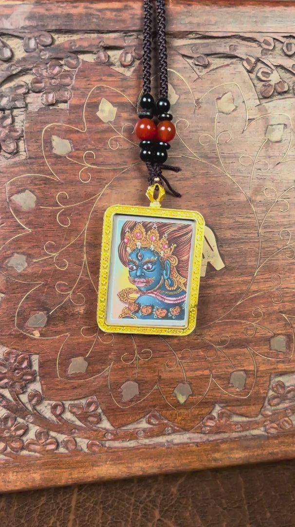 Mahakala Ghau Thangka locket with hand-painted wrathful deity artwork inside traditional Himalayan amulet Nepal