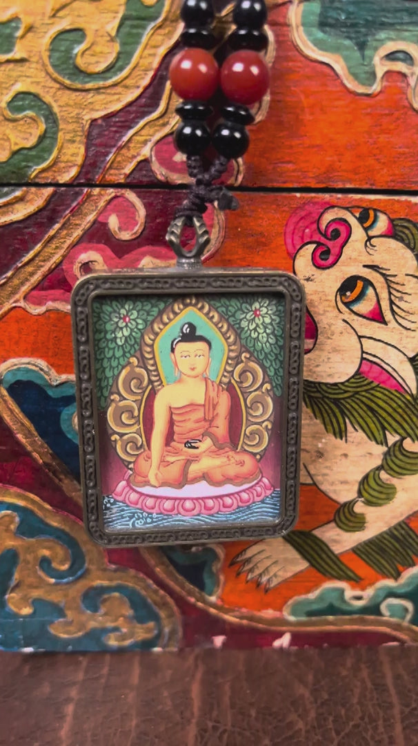 Shakyamuni Buddha Miniature Thangka locket with hand-painted Buddha artwork inside traditional Himalayan amulet Nepal