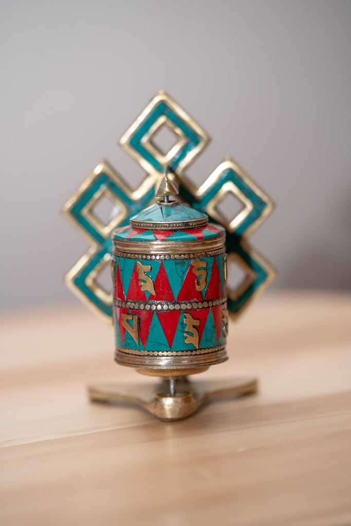 Endless Knot Prayer Wheel serves as a means to cultivate mindfulness and focus. 